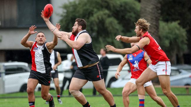 St Kilda v Port Melbourne Colts at Peanut Farm Reserve, St Kilda, Melbourne, April 15th 2023. St Kilda City no 92 rucks against Port Melbourne Colts D Kovacevic. Picture : George Sal