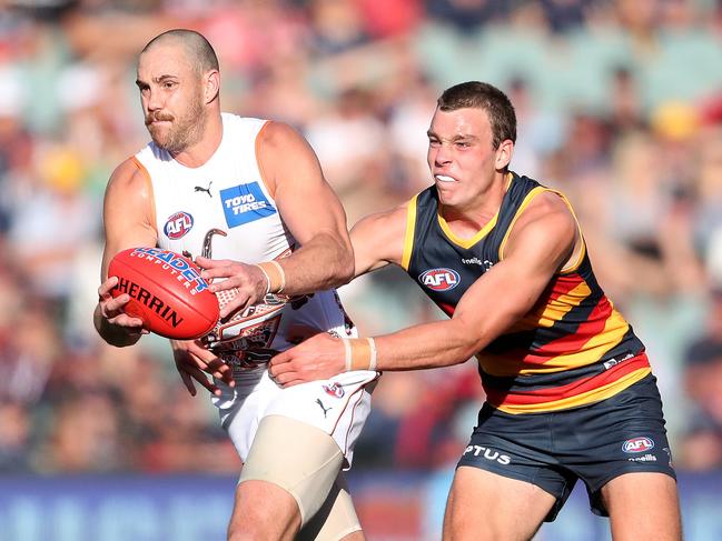 Mumford (left) played 116 games for the Giants. Picture: Sarah Reed/AFL Photos via Getty Images