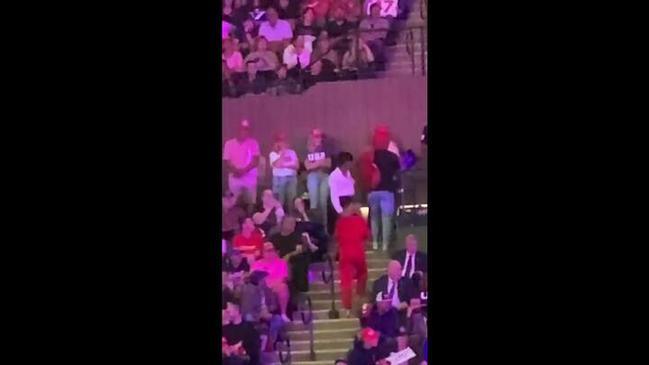 Woman escorted out of Trump rally after flashing her breasts in the stands