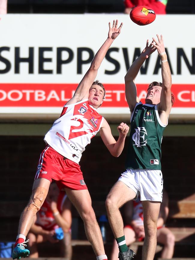 Shepparton Swans’ James Auld and Echuca’s Logan Orr compete in the air.