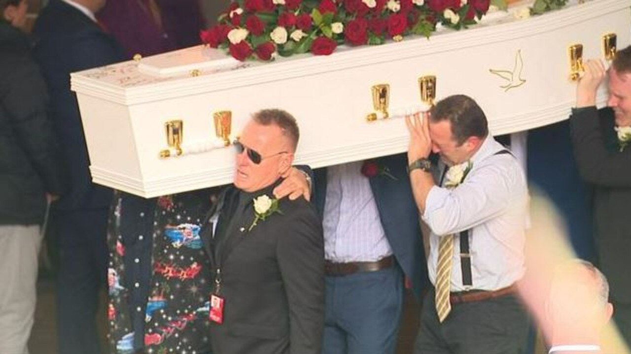 Mr Bray’s loved ones carry his casket from the funeral service. Picture: 7 News