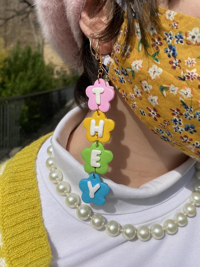 Clover Willemsen, 27 wearing their homemade earrings.