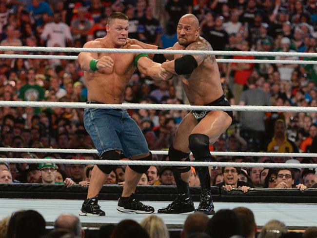 Cena takes on his long-time rival Dwayne “The Rock” Johnson in 2012. (Pic: Getty Images)