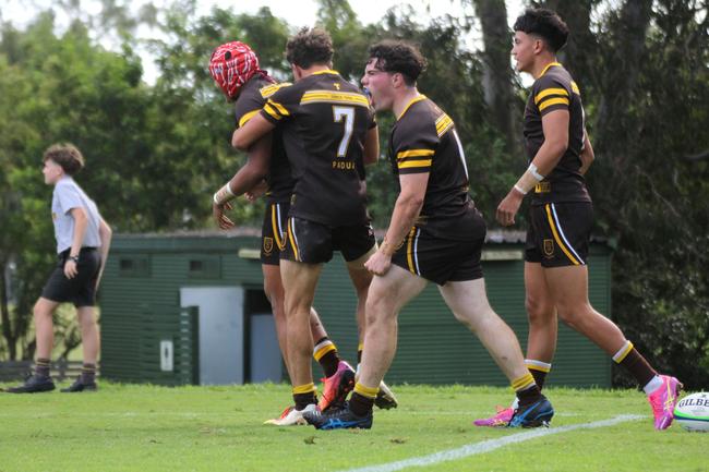 Jack Mercer (centre) celebrates a Faalafi try.