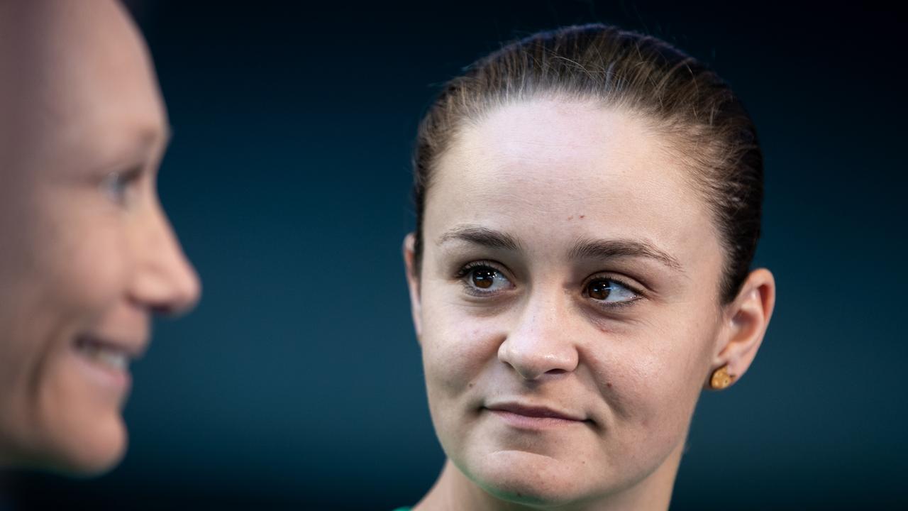 Ash Barty keeps a close eye on Sam Stosur during a press conference.