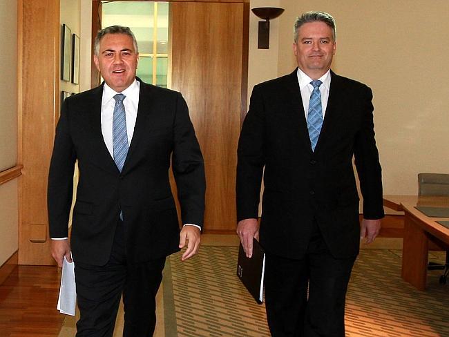 Bad news ... Treasurer Joe Hockey and Finance Minister Mathias Cormann at Parliament House in Canberra. Picture: Kym Smith