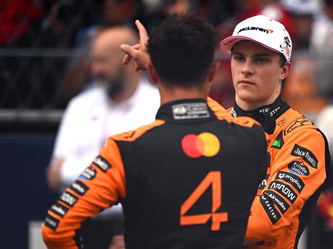 MIAMI, FLORIDA - MAY 03: Second placed Oscar Piastri of Australia and McLaren and Sprint winner Lando Norris of Great Britain and McLaren talk in parc ferme during the Sprint ahead of the F1 Grand Prix of Miami at Miami International Autodrome on May 03, 2025 in Miami, Florida.   Rudy Carezzevoli/Getty Images/AFP (Photo by Rudy Carezzevoli / GETTY IMAGES NORTH AMERICA / Getty Images via AFP)
