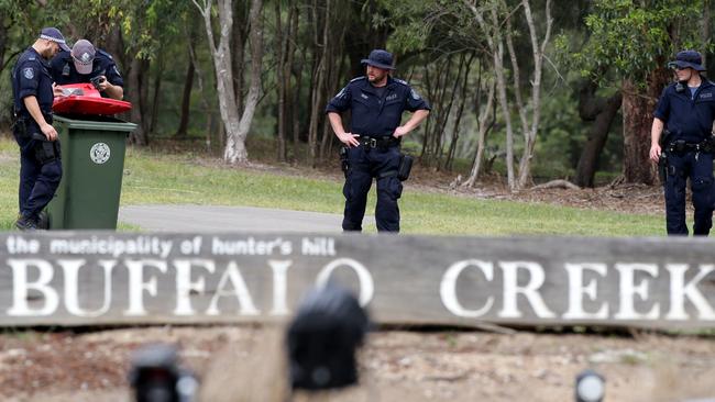 Police officers searching for evidence at the crime scene. Picture: Jonathan Ng