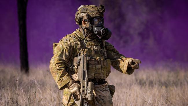 An Australian army section commander from the 3rd Battalion, Royal Australian Regiment commands his section during a chemical, biological, radiological and nuclear defence (CBRND) serial during the 2022 Duke of Gloucester Cup in Singleton. *** Local Caption *** Australian Army infantry soldiers from across Australia tested their core skills for the prestigious Duke of Gloucester Cup at the School of Infantry, near Singleton in NSW, July 31 - August 5 2022.  The Duke of Gloucester Cup is the Armyâs premier military skills competition, pitting the best Royal Australian Corps of Infantry rifle sections from each unit against one another through a series of challenging activities that test their core infantry skills, including marksmanship, tactics, teamwork and fitness.  Along with the Duke of Gloucester Cup, five other trophies are awarded: Sir Arthur MacDonald Trophy for best foundation war-fighting skills; Gurkha Trophy for best live-fire shooting; Royal Ulster Rifles Trophy for best falling plate shooting; OSCMAR Trophy for best battle endurance; and the DSM Roche CSC Memorial Cup for best individual soldier.  The Duke of Gloucester Cup was created by Prince Henry, Duke of Gloucester, in 1946, while serving as the Governor-General of Australia.