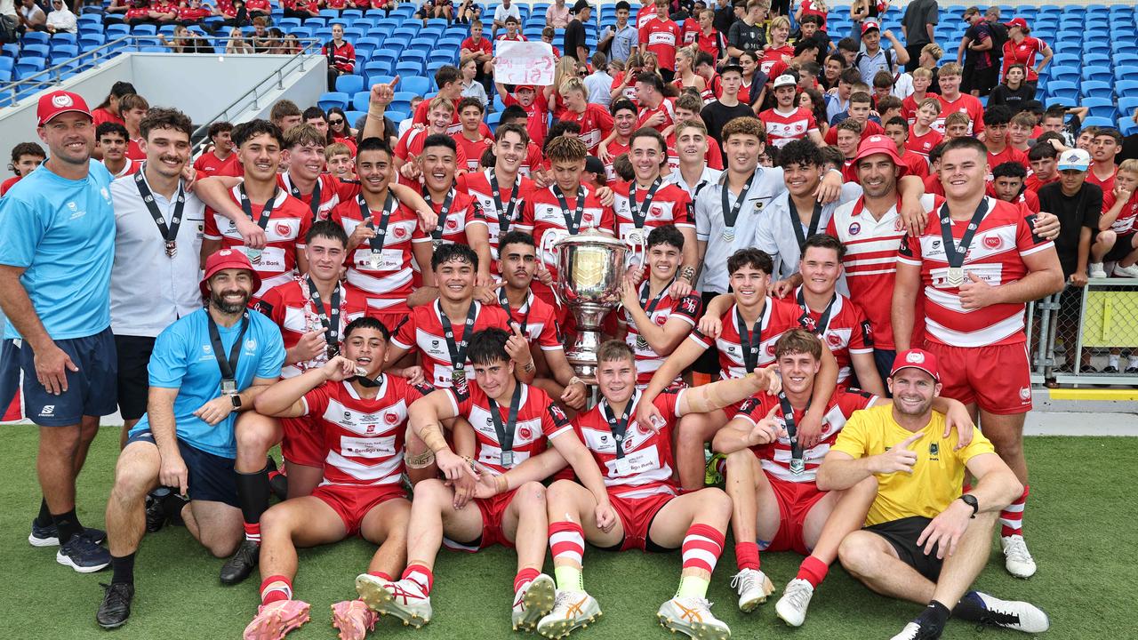 NRL National Schoolboys Cup final at CBUS Stadium between Palm Beach Currumbin and Patrician Blacktown Brothers. The Red Army and Palm Beach Currumbin players celebrate the win. .Picture Glenn Hampson