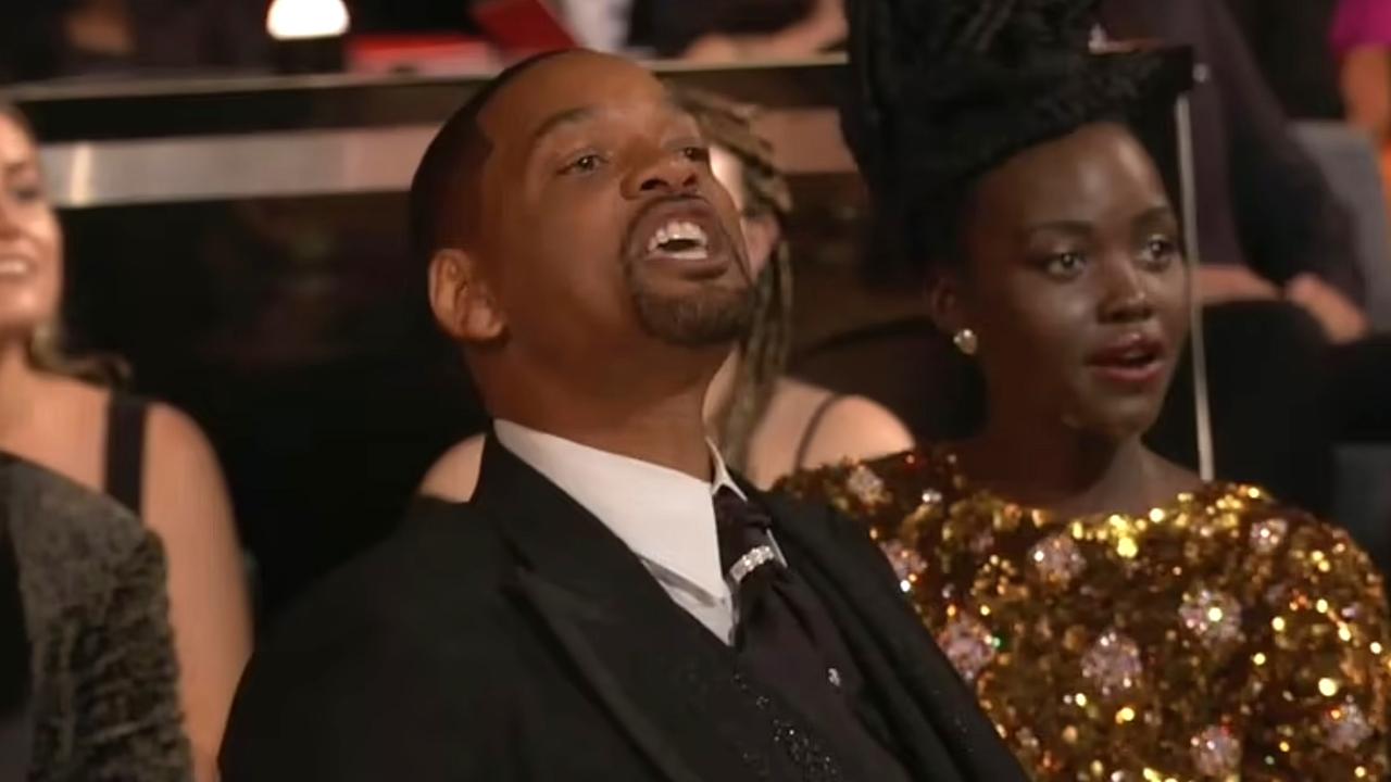 Will Smith, visibly emotional, walked back to his seat in the audience and shouted: 'Keep my wife's name out of your f***ing mouth' to Chris Rock after slapping him on stage at the 2022 oscar awards. Picture: ABC