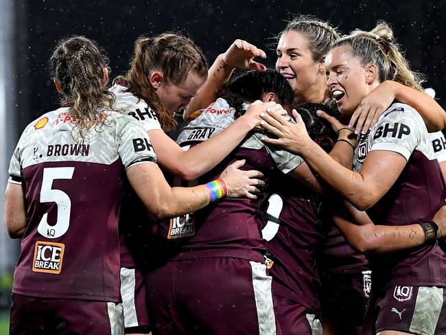 SUNSHINE COAST, AUSTRALIA - JUNE 25: Destiny Brill of Queensland is congratulated by team mates after scoring a try during the Women's Rugby League State of Origin match at the Sunshine Coast Stadium on June 25, 2021 in Sunshine Coast, Australia. (Photo by Bradley Kanaris/Getty Images)