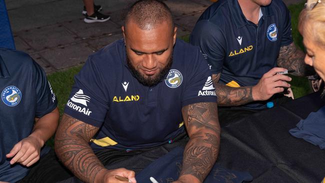 Junior Paulo signs a jersey for a fan on the Darwin Waterfront. Picture: Pema Tamang Pakhrin