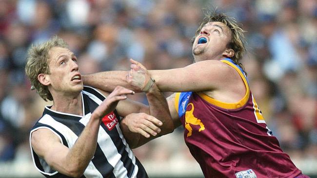 Clark Keating battles with Collingwood’s Josh Fraser during the 2003 AFL grand final.