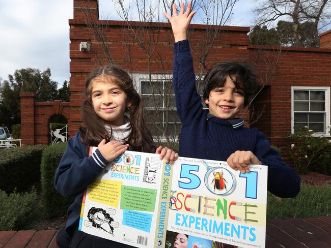 Port Phillip Leader has been campaigning for a primary school in South Melbourne, the proposed site in Albert Park. Miranda, 7, and Jeremy, 5, outside the proposed site.