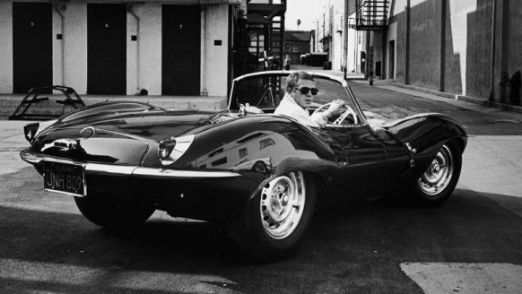 Actor Steve McQueen in his 1956 Jaguar Le Mans car.