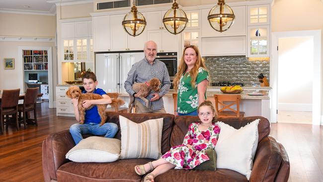 Fergus and Felicity Davidson at home with their children in Pymble. Picture: Peter Rae