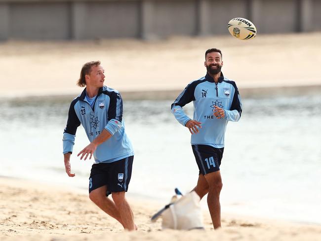 Rhyan Grant and Alex Brosque during the Sydney FC recovery session at Balmoral Beach after their 6-1 win over Melbourne Victory earning a spot against Perth in the A-League Final. Picture. Phil Hillyard