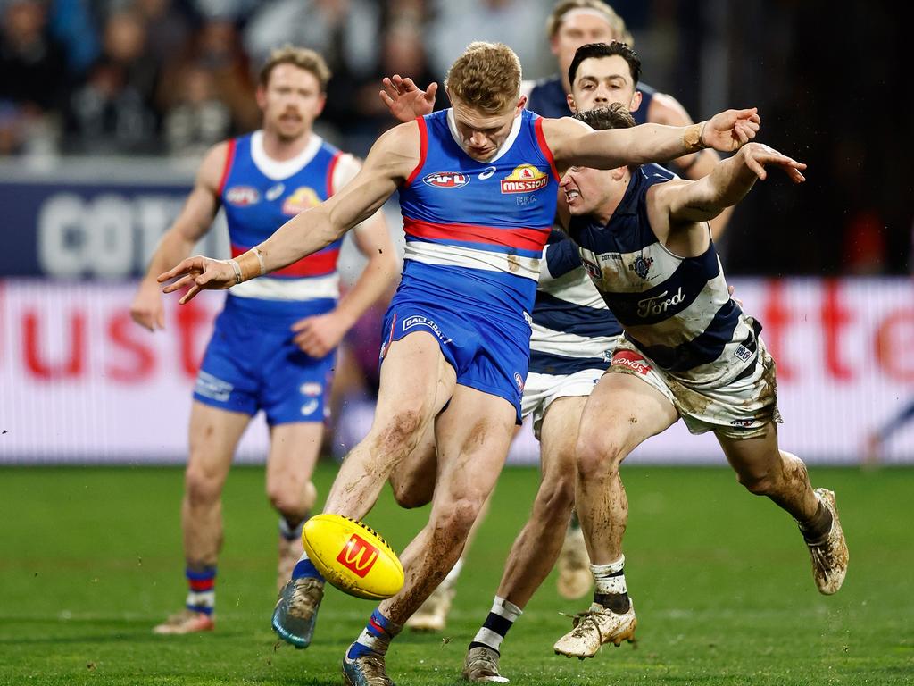 Adam Treloar gets a kick away before being tackled. Picture: Michael Willson/AFL Photos via Getty Images