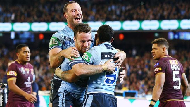 Boyd Cordner and James Maloney celebrate after Josh Addo-Carr scores during game one. Picture: Getty Images.