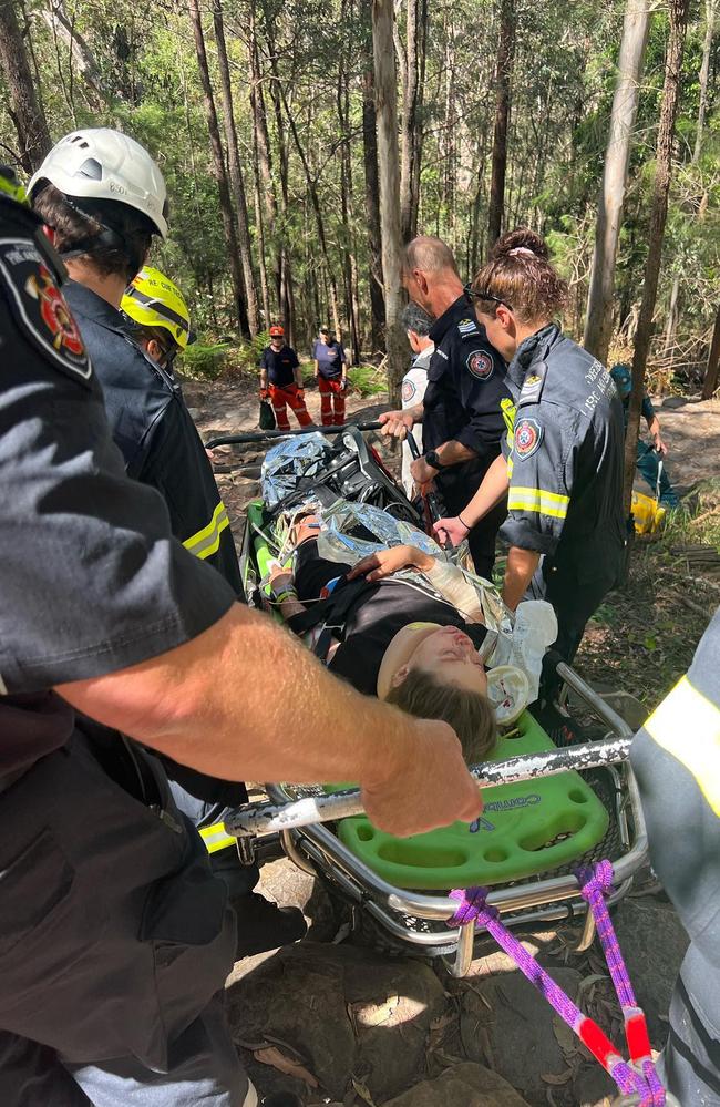 Emergency crews helping Cheyanne down Mt Ngungun. Picture: Facebook