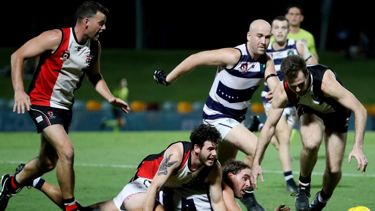 AFL Cairns Seniors Grand Final: Port Douglas vs Cairns Saints at Cazalys. Saints' Nathan Edwards, Alex Galea and Wesley Glass take on Crocs' Kye Chapple and Adam Gross. Picture: Stewart McLean