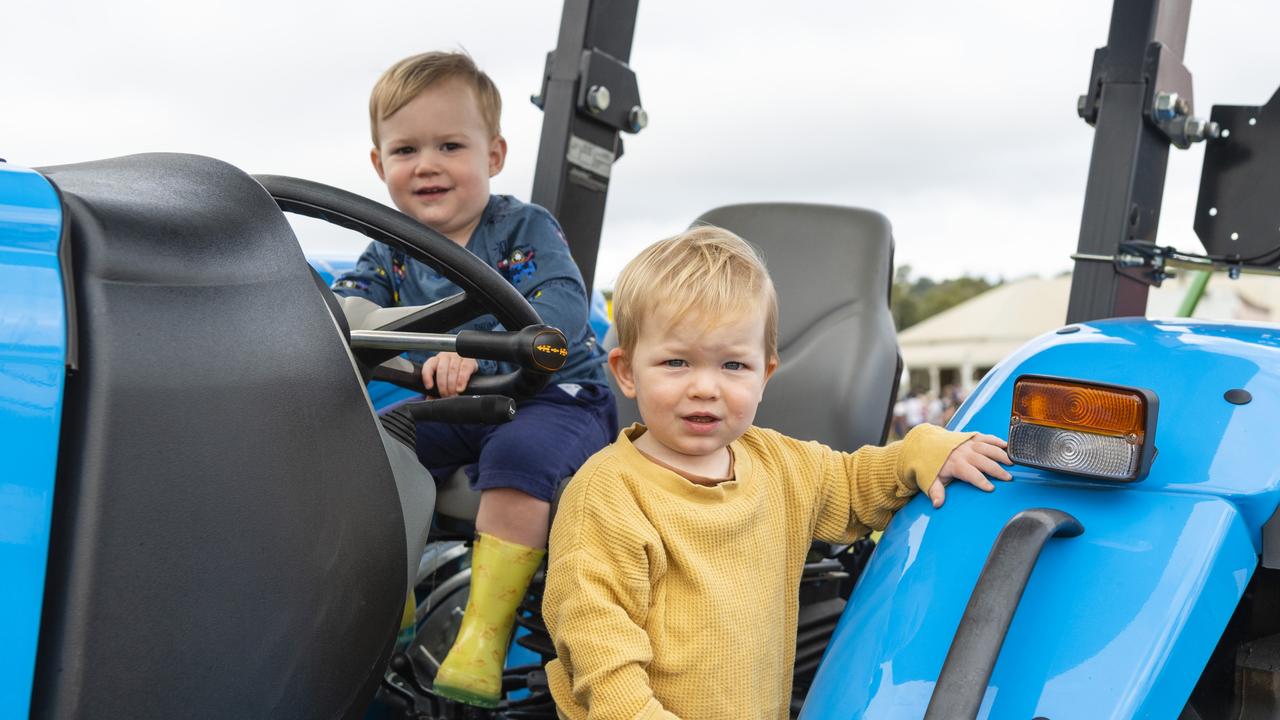 Vinnie Hannant (left) and Sonny Leek check out one of the tractors on display at the 2022 Toowoomba Royal Show, Friday, March 25, 2022. Picture: Kevin Farmer2022 Toowoomba Royal Show, Friday, March 25, 2022. Picture: Kevin Farmer