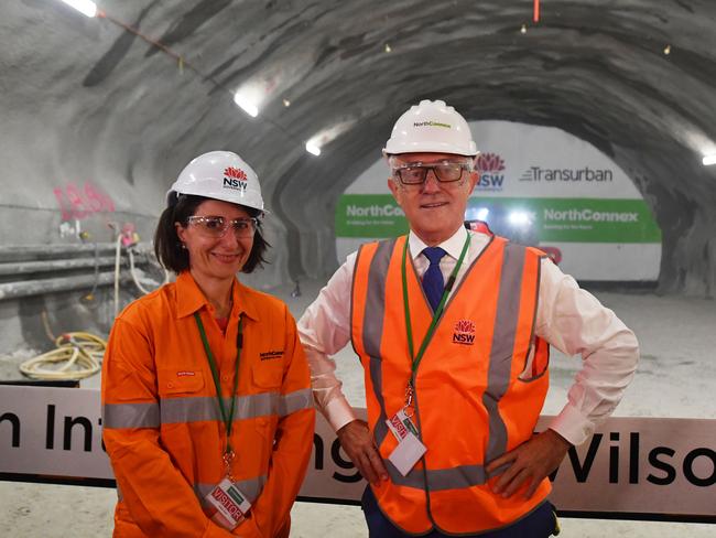 Prime Minister Malcolm Turnbull and NSW Premier Gladys Berejiklian watch the first tunnel breakthrough of the NorthConnex project in West Pennant Hills in Sydney, Wednesday, December 13, 2017. (AAP Image/Mick Tsikas) NO ARCHIVING