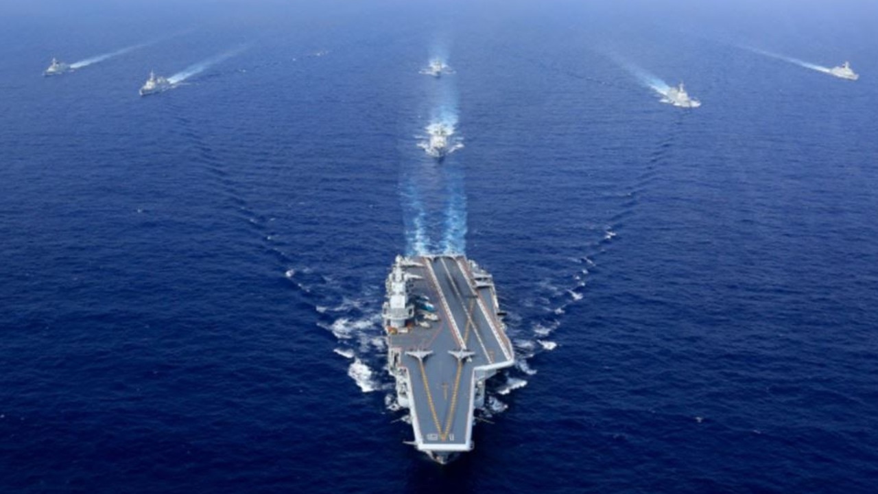 A Chinese aircraft carrier leads its task group in manoeuvres. Picture: ChinaMil/PLA