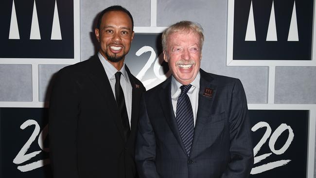 Phil Knight alongside Tiger Woods. (Photo by Gustavo Caballero/Getty Images)