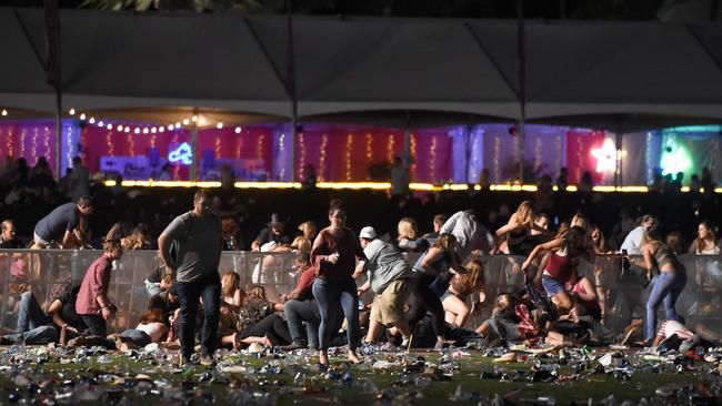 People flee from the Route 91 Harvest Festival after Stephen Paddock opened fire from the nearby Mandalay Bay Hotel and Casino. Picture: AFP