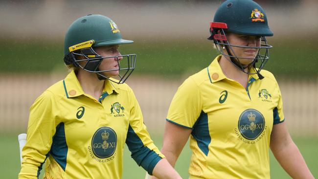 SYDNEY, AUSTRALIA - JANUARY 09: Alyssa Healy of Australia and Georgia Voll of Australia walk from the field as rain delays the match during the One Day match between Governor General's XI and England Women at North Sydney Oval, on January 09, 2025, in Sydney, Australia. (Photo by Brett Hemmings/Getty Images)