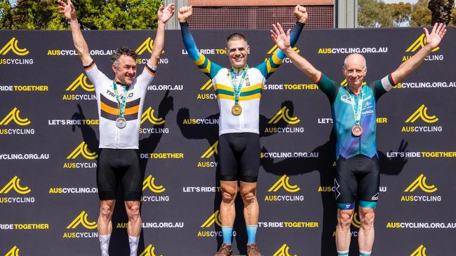 Phillip Brownscombe (centre) standing atop the podium after winning gold at the Masters. Picture: Contributed.