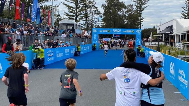 Marathon participants running towards the finish line