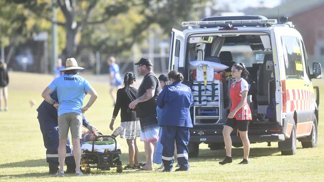 A South Grafton Rebels under-14 junior rugby league player is carted off for a neck injury after a tackle against the Grafton Ghosts at Frank McGuren Field on Saturday, August 29, 2020. Picture: Adam Hourigan