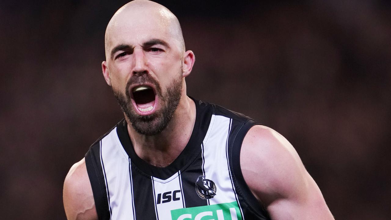 Steele Sidebottom celebrates the Pies stunning win. Picture: AAP