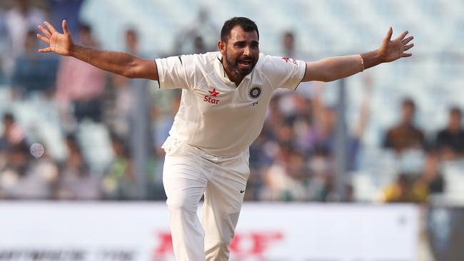 Indian bowler Mohammed Shami successfully appeals for the wicket of New Zealand's Mitchell Santner.