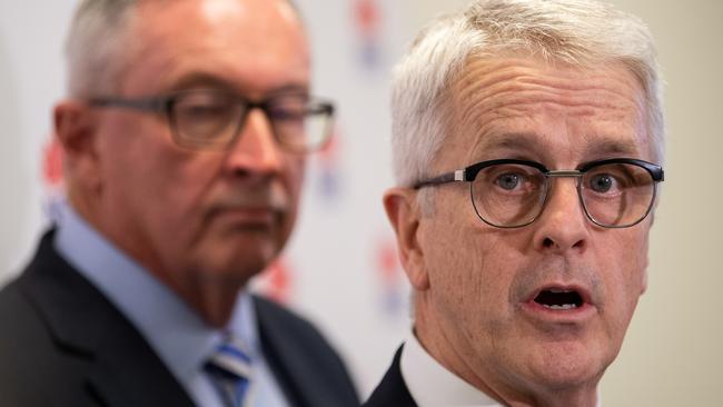 Dominc Dwyer pictured alongside NSW Health Minister Brad Hazzard at a coronavirus press conference in February 2020. Picture: AAP Image/James Gourley