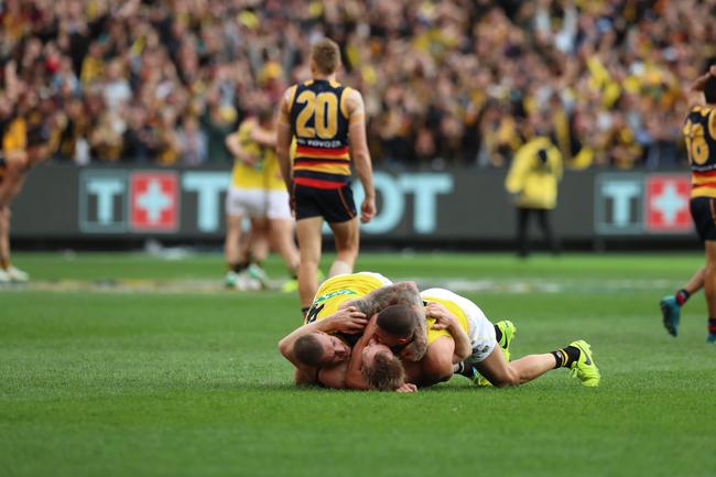 Shaun Grigg, Jack Riewoldt and Dustin Martin celebrate on the final siren of the 2017 AFL Grand Final between the Adelaide Crows and Richmond Tigers at the Melbourne Cricket Ground. Picture: Alex Coppel.