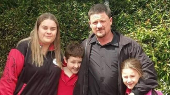 Warren Laing with his three children. Picture: GoFundMe