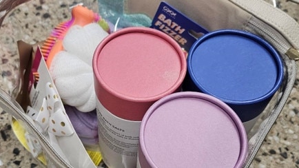Meth was found inside bath salts containers in luggage. Picture: SAPOL