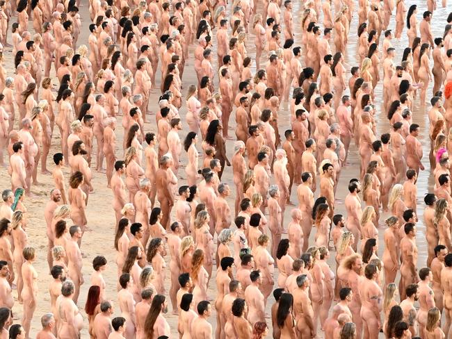 SYDNEY, AUSTRALIA - NewsWire Photos NOVEMBER 26, 2022: Sydney-siders strip bare naked at Bondi Beach this morning for a Spencer Tunick photograph to raise awareness on the importance of early detection for skin cancer.Picture: NCA NewsWire / Jeremy Piper