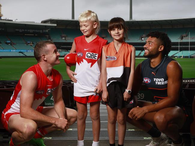 DAILY TELEGRAPH - 28.4.24MUST CHECK WITH PIC EDITOR BEOFRE USE - AFL fans Beau Yandell (2nd from left) and Alina Stephenson (2nd from right) pictured with Sydney Swans player Chad Warner (left) and GWS player Connor Idun (right) before the local derby on the weekend. Picture: Sam Ruttyn