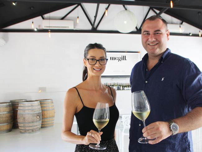 Alana Oppelt and Mark McGill toast the success of The McGill Group in opening at Kayleigh Drive in Buderim.