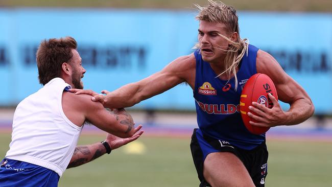 Bailey Smith is back in action, fending off Caleb Daniel during Tuesday’s session. Picture: Michael Klein