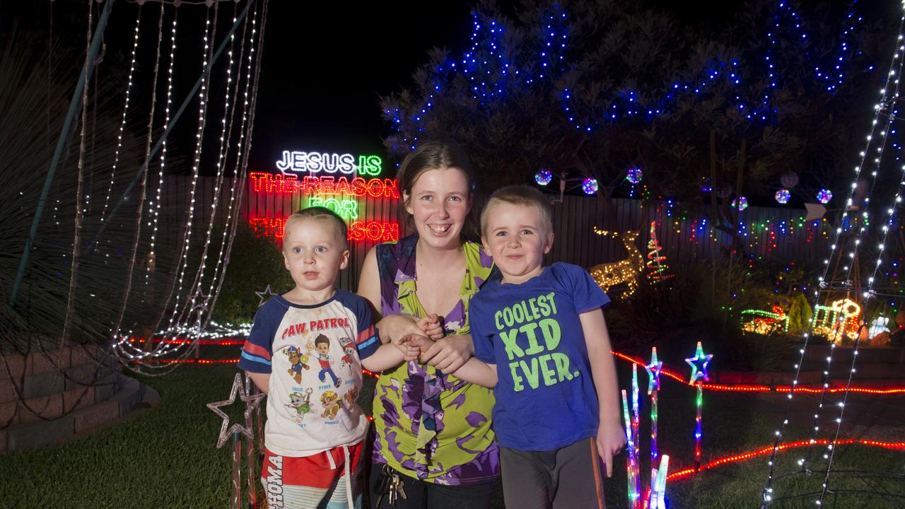 Natasha Horder with sons Noah (left) and Xavier Horder have fun at John Gamble's Grant Cl entry of Toowoomba Christmas Lights Competition, Friday, December 11, 2015. Photo Kevin Farmer / The Chronicle