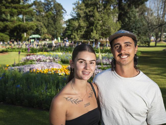 Paris Wiebrecht and Ben Pereira visiting from Perth in Queens Park for Carnival of Flowers, Saturday, September 21, 2024. Picture: Kevin Farmer