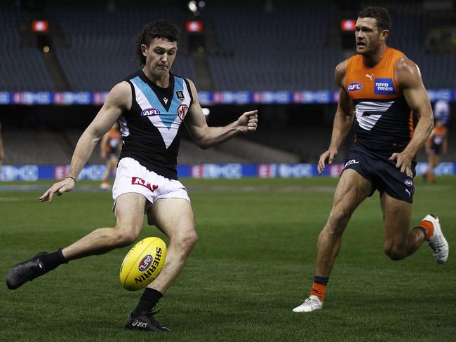 MELBOURNE, AUSTRALIA - AUGUST 01: Darcy Byrne-Jones of the Power kicks the ball during the round 20 AFL match between Greater Western Sydney Giants and Port Adelaide Power at Marvel Stadium on August 01, 2021 in Melbourne, Australia. (Photo by Daniel Pockett/Getty Images)