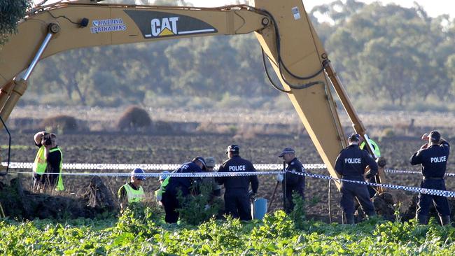 Police search a farm in Maude Rd, Hay, for the remains of Mr Mackay in 2013.