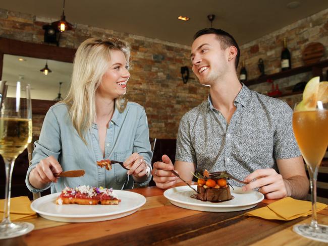 Libby Phillipps and Tyler Knight both checked in their phones before dining. Picture: Richard Dobson